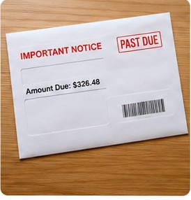 Photo of a past due notice on a desk